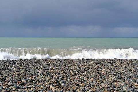 Dramatic storm waves crashing on a pebble beach, Black Sea coast Stock-Fotos