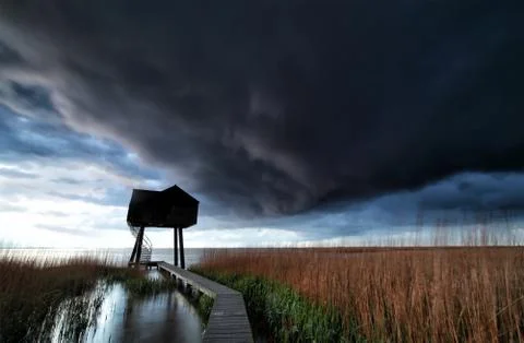 Dramatic stormy cloud over wooden tower Stock Photos