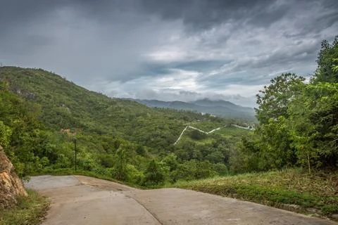 Dramatic stormy cloud sky above tropical mountains. Storm Pabuk, Thailand. Stock Photos