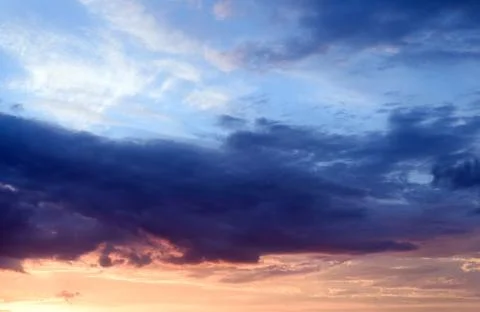 Dramatic stormy clouds with abeautiful amazing colors and a sunset with no la Stock Photos