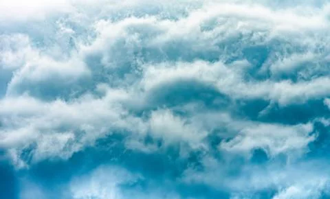 Dramatic stormy clouds, close up view on a fluffy cumulus before storm. Stock Photos