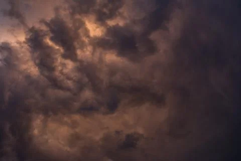 Dramatic stormy clouds with orange hue Stock Photos