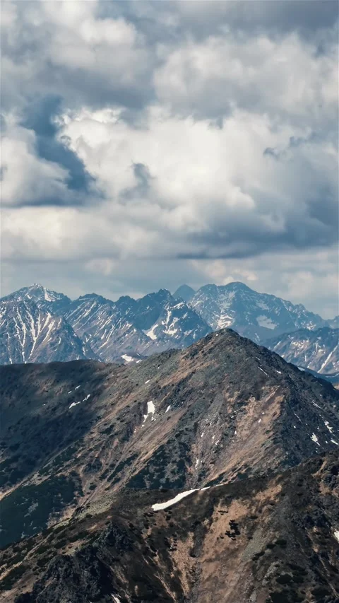 Dramatic Stormy Clouds Rolling Over Alpine Mountain Peaks Vertical Time Lapse Stock Footage 310318200