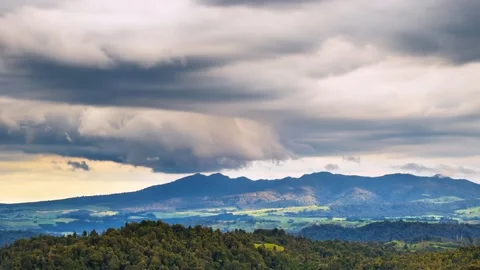 Dramatic stormy clouds sky motion fast over New Zealand wild mountains nature Stock Footage 149375816
