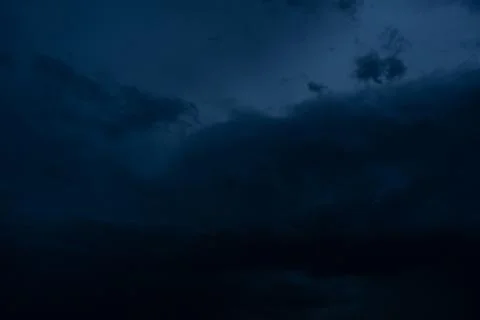 Dramatic stormy dark cloudy sky, natural photo background Stock Photos