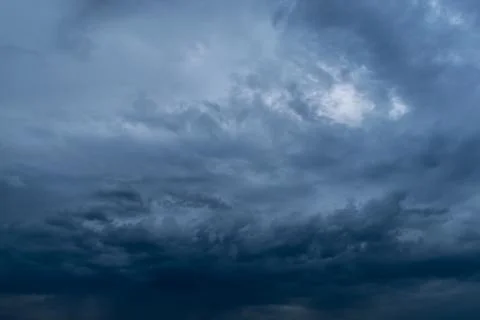 Dramatic stormy dark cloudy sky, natural photo background Stock Photos