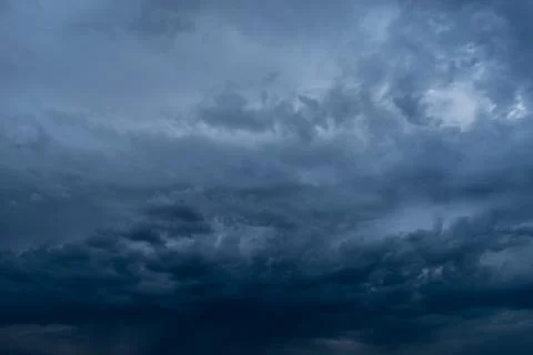 Dramatic stormy dark cloudy sky, natural photo background Stock Photos