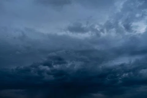 Dramatic stormy dark cloudy sky, natural photo background Stock Photos