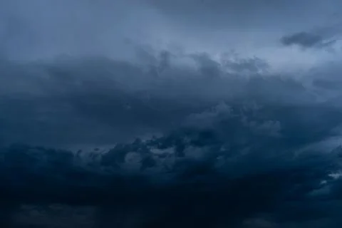 Dramatic stormy dark cloudy sky, natural photo background Stock Photos