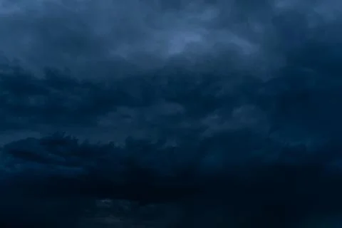 Dramatic stormy dark cloudy sky, natural photo background Stock Photos