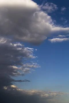 Dramatic stormy gray clouds with blue sky. Stock Photos