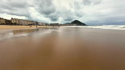 A dramatic stormy seaside view featuring captivating reflections and a stun.. Stock Photos