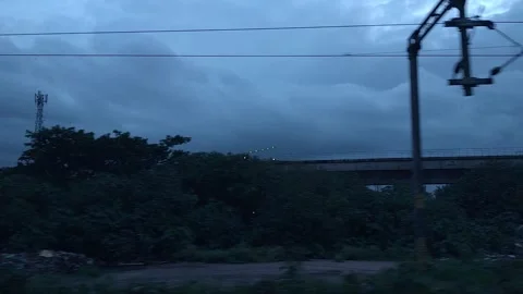 Dramatic stormy skies loom over an urban industrial landscape with an eleva.. Stock Footage 341351332