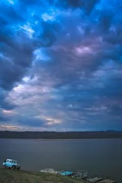 Dramatic stormy sky over a lake Stock Photos