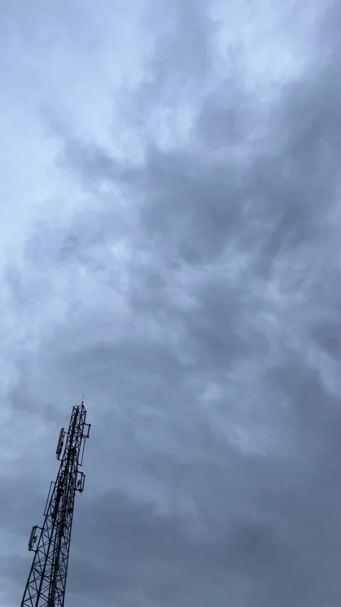 Dramatic Stormy Sky Over Telecom Tower 库存影片 332368780
