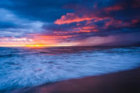 Dramatic stormy sunset and waves in the Pacific Ocean, seen at Venice Beach,  Stock Photos