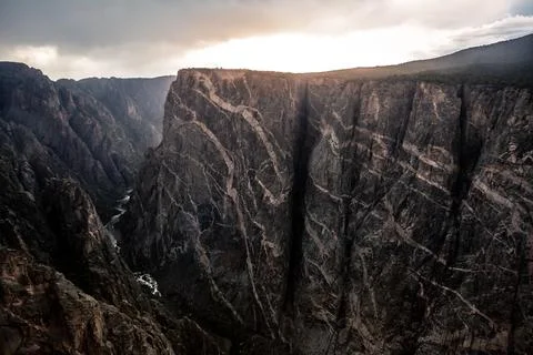 Dramatic Stormy Sunset on the Painted Wall, Black Canyon of the Gunnison Stock Photos