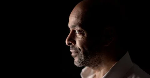Dramatic Studio Portrait Of Bald Man With Beard In Profile On Black Backgroun Stock Photos