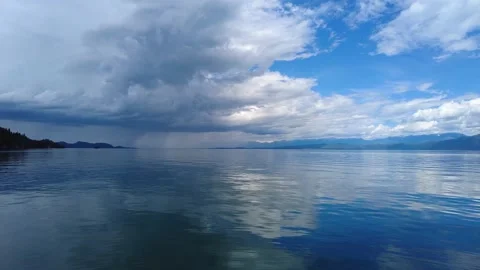 Dramatic summer clouds over Flathead Lake, Montana 4K. Stock Footage 199983614