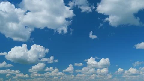 Dramatic Summer cloudscape. Blue sky white clouds. Changing cloudscape. Time Stock Photos