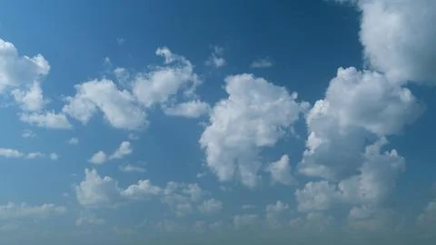 Dramatic summer cloudscape. Blue sky white clouds. Changing cloudscape Stock Photos