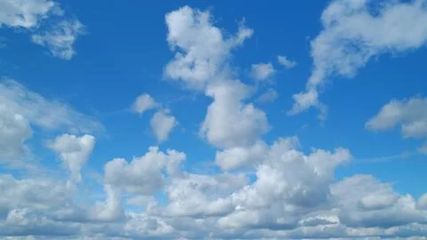 Dramatic summer cloudscape. Blue sky white clouds. Changing cloudscape Stock Photos