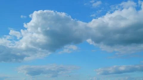 Dramatic Summer cloudscape. Blue sky white clouds. Changing cloudscape. Time 스톡 사진
