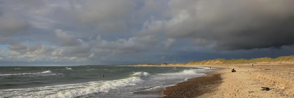 Dramatic summer sky over the beach in Klitmoller, Cold Hawaii. Stock Photos