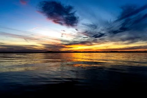 Dramatic summer sunset over Lake Mitkow in Poland. Evening landscape. Stock Photos