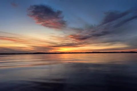 Dramatic summer sunset over Lake Mitkow in Poland. Evening landscape. Stock Photos