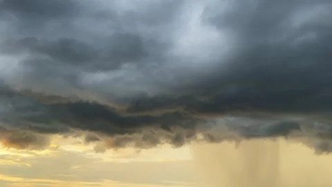 Dramatic summer thunderstorm rain at sunset Stock Footage 336257410