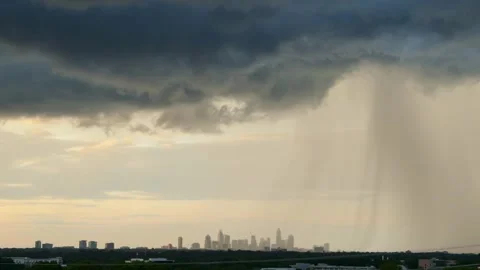 Dramatic summer thunderstorm rain at sunset over the Charlotte, NC Stock Footage 336257501