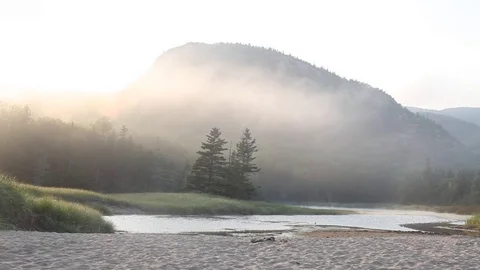 Dramatic sun over Arcadia national park with beach water and mountain Stock Footage 83460617