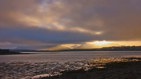 Dramatic sun rays and fog over stromness and Hoy Hills in Orkney in 4k Video stock 291659154