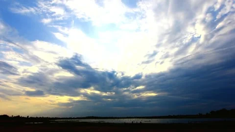 Dramatic Sun Rays Breaking Through Clouds Over Lake 스톡 동영상 310921580