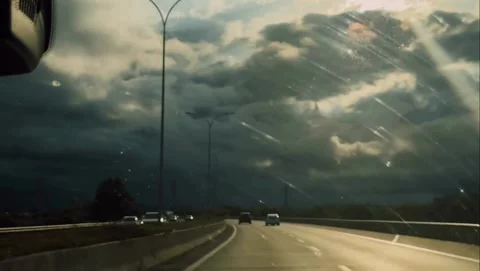 Dramatic Sun Rays Breaking Through Storm Clouds Over Highway Stock Footage 340868970