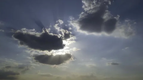 Dramatic Sun Rays Bursting Through Dark Clouds in Blue Sky. Stock Footage 342134950