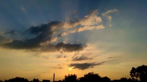 Dramatic Sun Rays Through Clouds at Golden Sunset Sky Silhouette Landscape Stock Footage 345400597