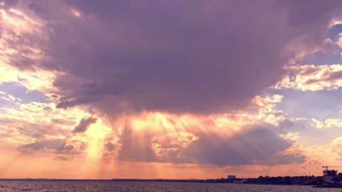 Dramatic Sunbeams and God Rays Breaking Through Storm Clouds Stockbeeldmateriaal 345135097