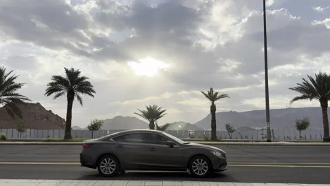 Dramatic Sunbeams Over a Highway Road During Golden Hour Stock Footage 323529875