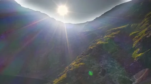 Dramatic sunburst over the ridgeline at Mount Snowden in Snowdonia Stock Footage 159198686