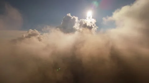 Dramatic sunlight breaking through thick aerial cloudscape Stock Footage 316216855