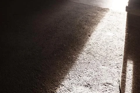 Dramatic Sunlight on Concrete Floor Surface Stock Photos