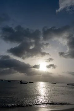 Dramatic sunlit cloudscape reflected across the Caribbean Sea at Manchineel Bay, Photos