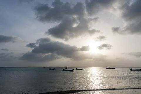 Dramatic sunlit cloudscape reflected across the Caribbean Sea at Manchineel Bay, Photos