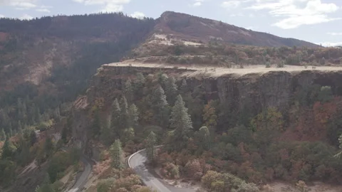 Dramatic sunny clifside of Rowena Loop in Fall Colors Stock Footage 332309813