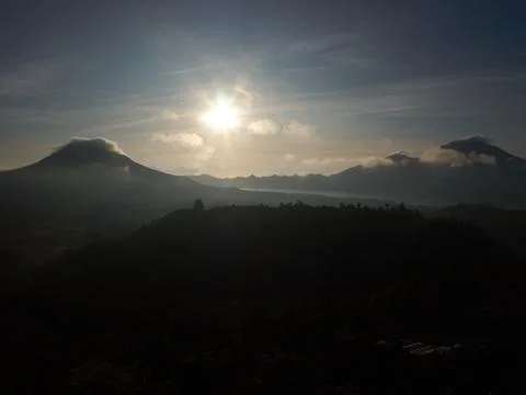 Dramatic sunrise between two hills Stock Photos