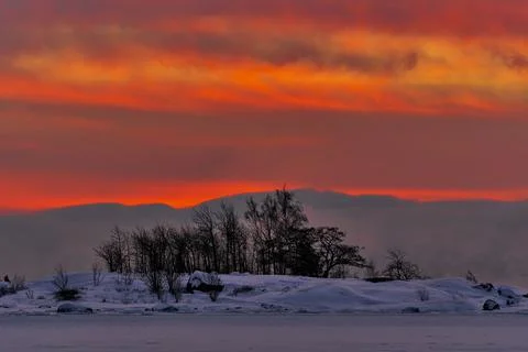 Dramatic sunrise on extremely cold winter morning Stock Photos
