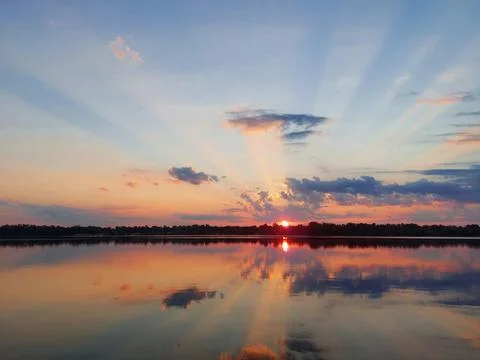Dramatic sunrise over the calm Dnipro river near Kaniv, Ukraine Stock Photos