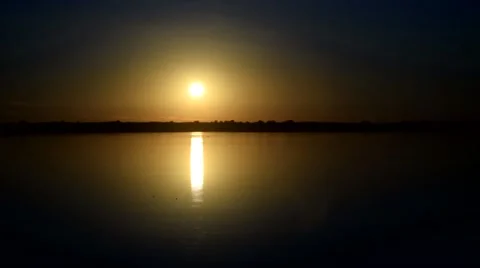 Dramatic sunrise over calm smooth water surface of river Stock Footage 67601951